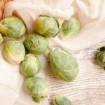 Brussels sprouts falling out of a basket