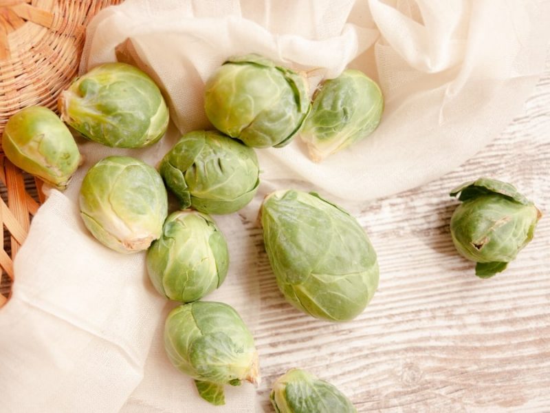 Brussels sprouts falling out of a basket